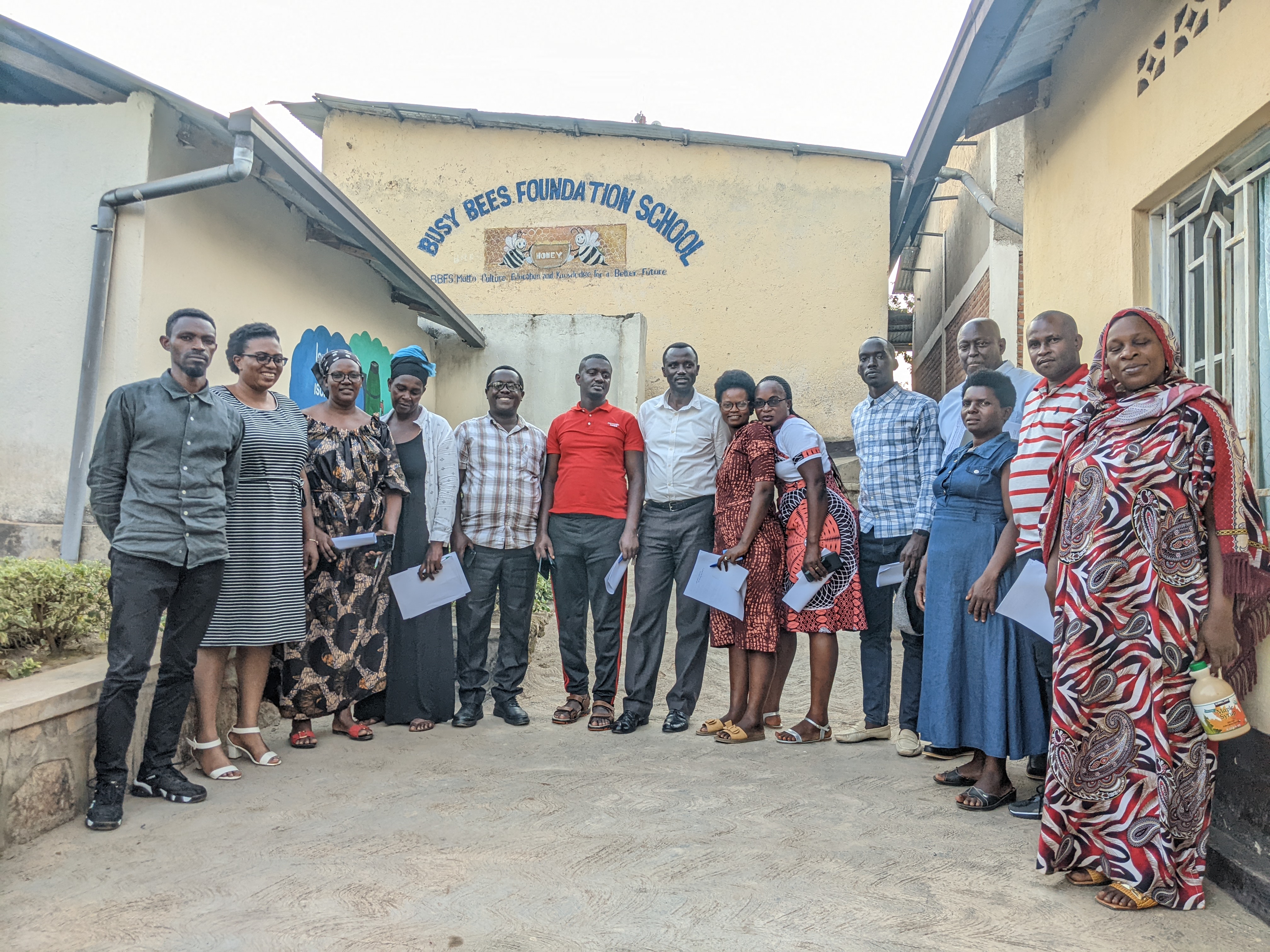 Local leaders from villages across Kagugu Cell gathered outside Busy Bees Foundation School